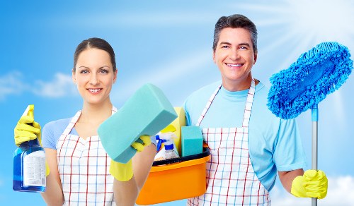 Cleaner working in a residential property during a service visit